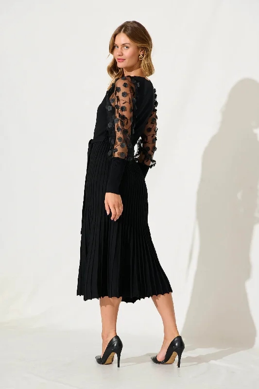 enchanted-midi-knit-dress-in-black-with-mesh-flower-detail